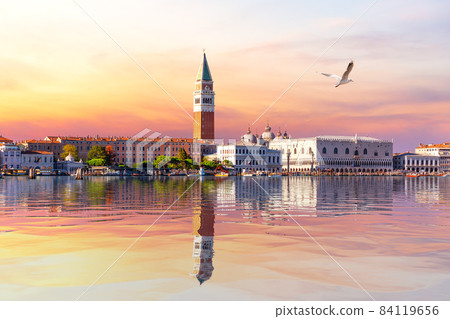 View of the Venice lagoon, St Mark's Bell Tower and Doge's palace at sunset, Italy 84119656