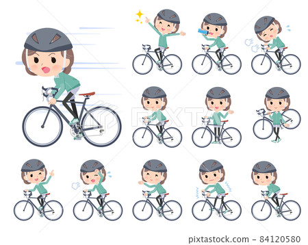 騎著公路自行車的藍綠色球衣中年婦女 84120580