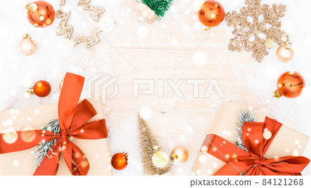 Snow wood. Winter wooden decoration background. Christmas board with old rustic wall, white frozen snowflake, golden balls and gift box. Merry Christmas holiday card pattern. Snow wood. Winter wooden decoration background. Christmas board with old rustic wall, white frozen snowflake, golden balls and gift box. Merry Christmas holiday card pattern. 84121268