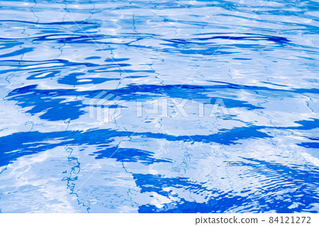 Water background texture. Blue wave pool surface. Summer sea abstract pattern. 84121272