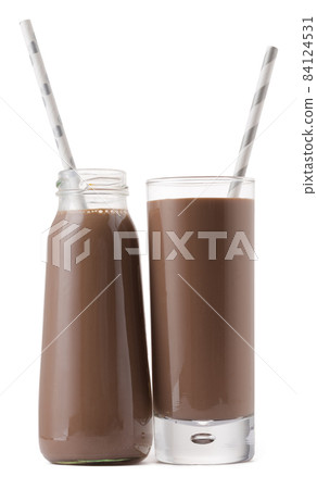 Glass cup of chocolate milk with a straw isolated on white 84124531