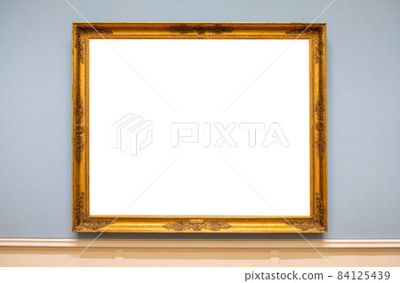 Golden carved picture frame on wall 84125439