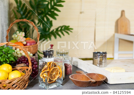 Decorated kitchen table ready to start your daily work on it. Fresh fruit stacked side by side. Decorated kitchen table ready to start your daily work on it. Fresh fruit stacked side by side. 84125594