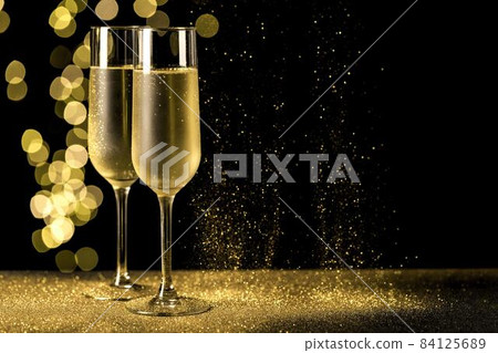 champagne glasses with bokeh lights. High quality beautiful photo concept 84125689