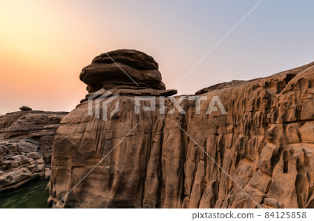 Natural eroded large rocky rapid geological in the evening Natural eroded large rocky rapid geological in the evening 84125858
