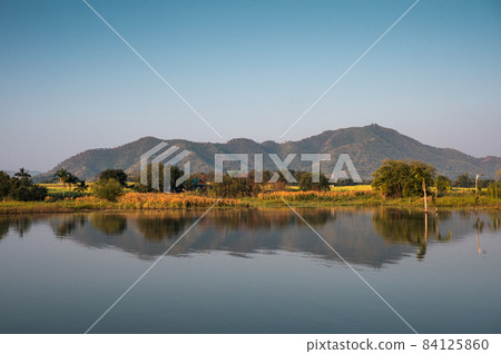 Mountain range reflected on Lam Thaphoen reservoir 84125860