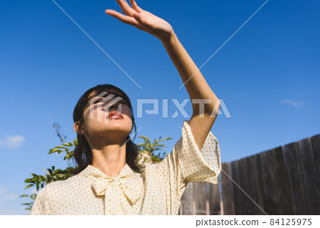 A woman in sunlight A woman in sunlight 84125975