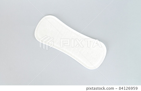 Natural daily sanitary pad or pantyliner top view on gray background 84126959