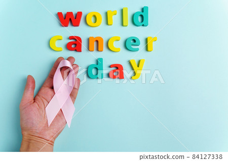 World Cancer Day, to raise awareness of all types of tumors supporting people living with diseases. Top view. Blue background. Copy Space World Cancer Day, to raise awareness of all types of tumors supporting people living with diseases. Top view. Blue background. Copy Space 84127338