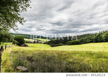 Scenic view at the German countryside over farmland Scenic view at the German countryside over farmland 84128113