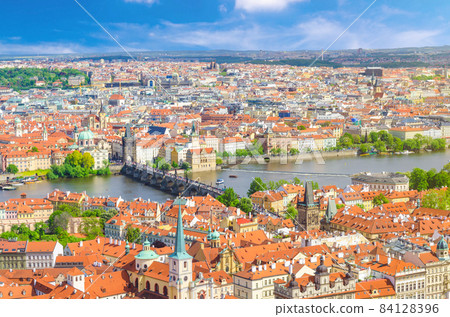Top aerial panoramic view of Prague historical city centre with red tiled roof buildings in Mala Strana Top aerial panoramic view of Prague historical city centre with red tiled roof buildings in Mala Strana 84128396