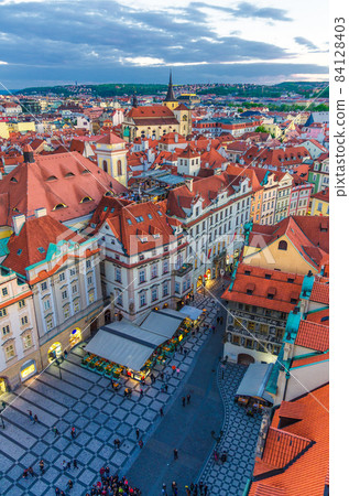 Top aerial panoramic view of Prague Old Town Stare Mesto historical city centre with red tiled roof buildings Top aerial panoramic view of Prague Old Town Stare Mesto historical city centre with red tiled roof buildings 84128403
