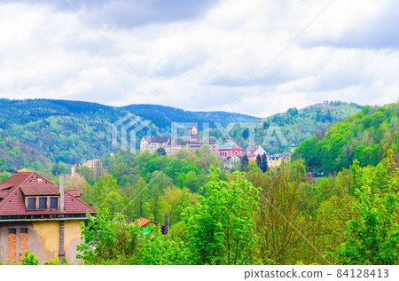 Loket Castle Hrad Loket gothic style building on massive rock and colorful buildings in Loket town Loket Castle Hrad Loket gothic style building on massive rock and colorful buildings in Loket town 84128413
