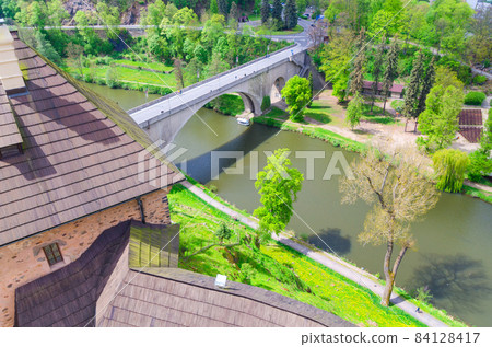 Bridge over Eger river top aerial view from walls of Loket Castle Hrad Loket gothic style building 84128417