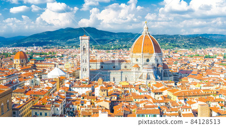 Top aerial panoramic view of Florence city with Duomo Cattedrale di Santa Maria del Fiore cathedral 84128513