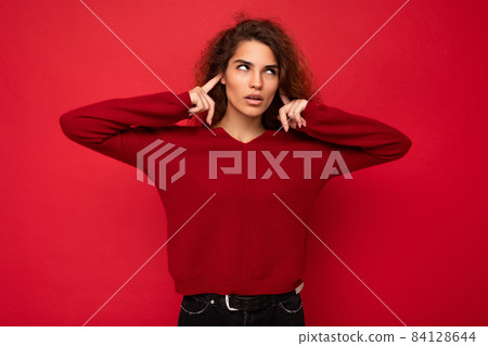 Photo of young tired sad dissatisfied attractive brunette wavy-haired woman with sincere emotions Photo of young tired sad dissatisfied attractive brunette wavy-haired woman with sincere emotions 84128644