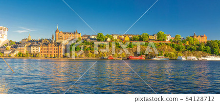 Panoramic view of Sodermalm island with Multicolor colorful fishing boats and ships on Lake Malaren Panoramic view of Sodermalm island with Multicolor colorful fishing boats and ships on Lake Malaren 84128712