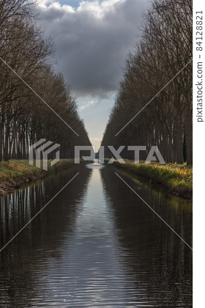 Colorful reflections at the canal near Bruges 84128821