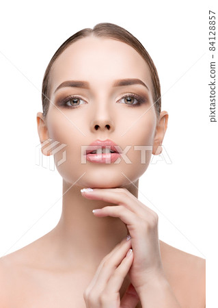 Beautiful Young Woman with Clean Fresh Skin isolated on white background Beautiful Young Woman with Clean Fresh Skin isolated on white background 84128857