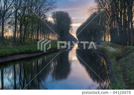 Colorful reflections at the canal near Bruges 84128878
