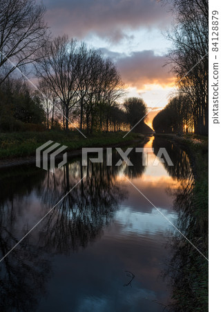 Colorful reflections at the canal near Bruges 84128879