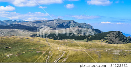 Landscape view over the Carpathian Alps in Romania Landscape view over the Carpathian Alps in Romania 84128881