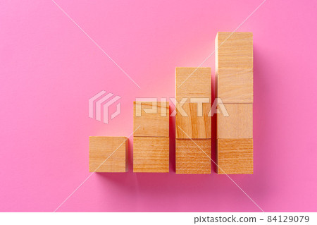 Top view of toy wooden blocks on pink Top view of toy wooden blocks on pink 84129079