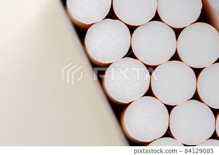 Open new pack of cigarettes close up Open new pack of cigarettes close up 84129085