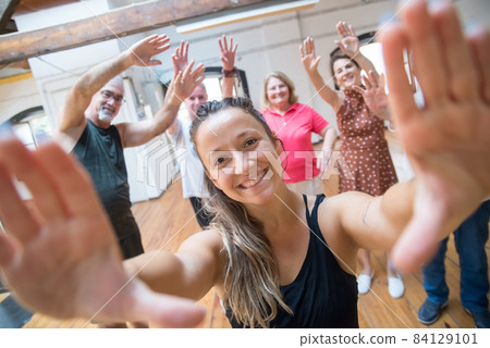 Hilarious young Caucasian dance teacher making frame with hands 84129101