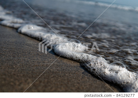 white foam on the shore, bali beach white foam on the shore, bali beach 84129277