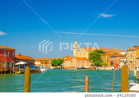 Murano islands water canal with Santa Maria degli Angeli church 84129380