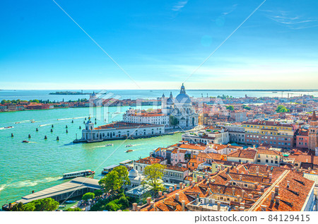 Aerial view of Venice city historical city centre, Santa Maria della Salute Catholic church Aerial view of Venice city historical city centre, Santa Maria della Salute Catholic church 84129415