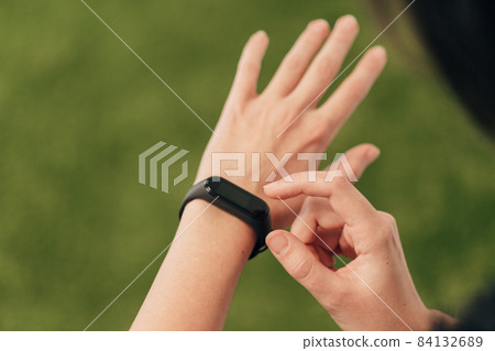 Girl Checking Her Heart Rate On Smart Watch After Gymnastic Exercises. 84132689