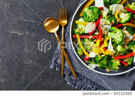 broccoli sweet pepper green beans salad on a plate 84132988