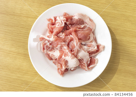 Cut off raw pork on a plate Cut off raw pork on a plate 84134456