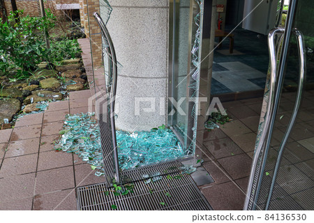 The glass door at the entrance of the condominium that was shattered by a large typhoon 84136530