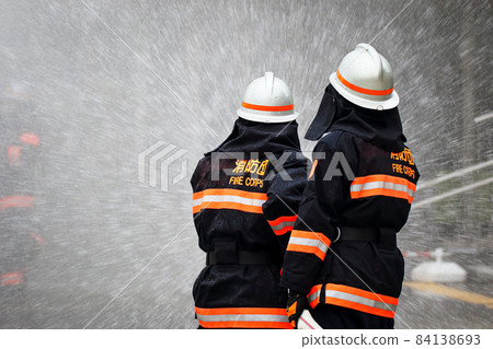 Fire extinguishing training by water discharge by firefighters Fire extinguishing training by water discharge by firefighters 84138693