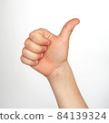 Thumb up. Child's hand showing thumb up, like, positive sign. 84139324