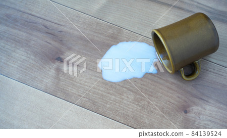 Spill milk on the floor / flooring Spill milk on the floor / flooring 84139524