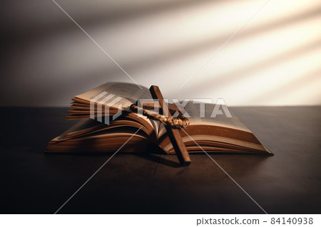 Spirituality, Religion and Hope Concept. Holy Bible and Cross on Desk. Symbol of Humility, Supplication,Believe and Faith for Christian People Spirituality, Religion and Hope Concept. Holy Bible and Cross on Desk. Symbol of Humility, Supplication,Believe and Faith for Christian People 84140938