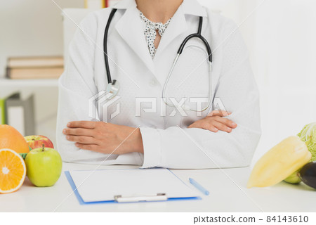 close up doctor with stethoscope fruits. High quality beautiful photo concept 84143610