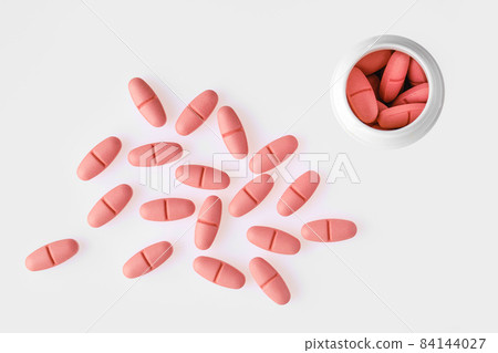 Overhead view of multi vitamin comples pills 84144027
