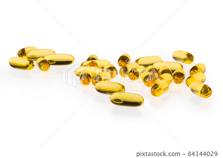 Omega 3 capsule scattered on white background 84144029