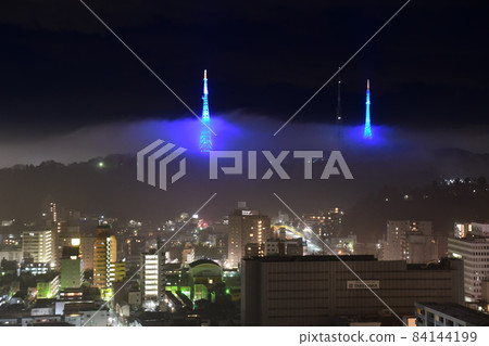 Radio tower floating in the night fog Radio tower floating in the night fog 84144199