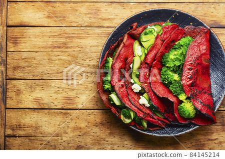 Fried beetroot pancakes with vegetable filling 84145214