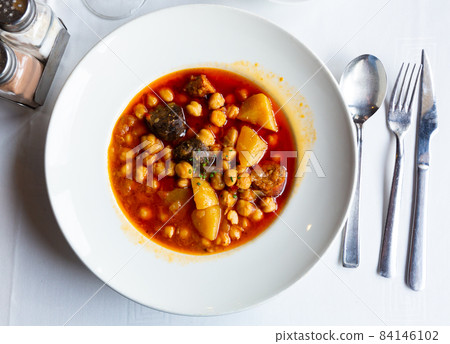 Chickpea soup with chorizo and potatoes Chickpea soup with chorizo and potatoes 84146102