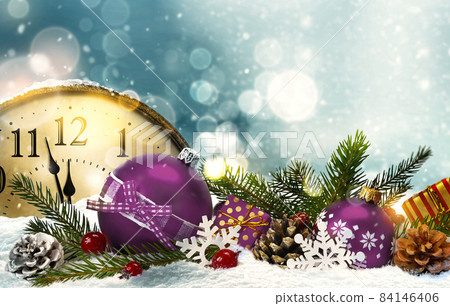 Retro style clock New Year's Eve with christmas decorations bokeh lights background 84146406