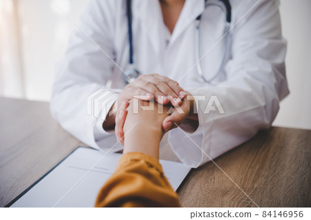 Close-up of the psychiatrist's hand holding the patient's hand. To encourage and comfort the patient. 84146956