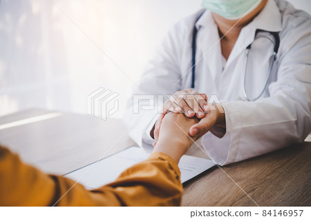 Close-up of the psychiatrist's hand holding the patient's hand. To encourage and comfort the patient. 84146957