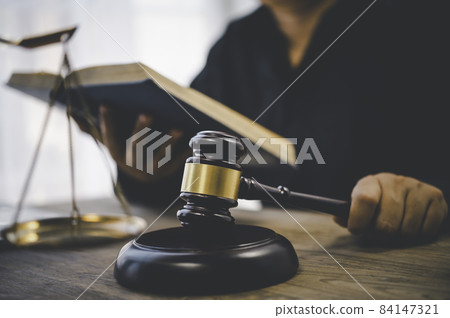 Law theme, mallet of the judge, law enforcement officers, evidence-based cases, and documents taken into account. Law theme, mallet of the judge, law enforcement officers, evidence-based cases, and documents taken into account. 84147321